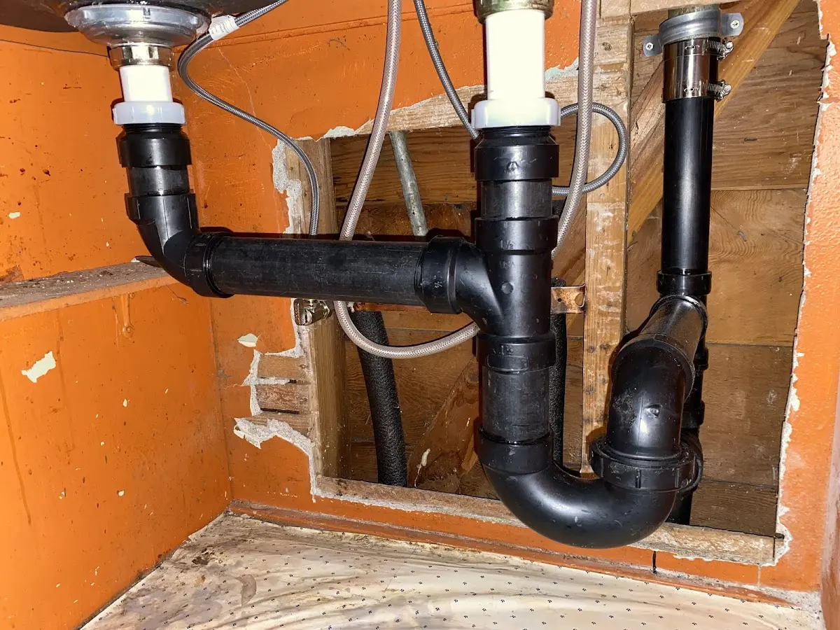Professional Garbage Disposal Repair equipment and tools on the job in Florence